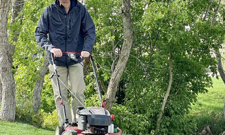 millennial-male-mowing-lawn-on-cool-spring-morning-2023-11-27-04-54-14-utc millennial-male-mowing-lawn-on-cool-spring-morning-2023-11-27-04-54-14-utc